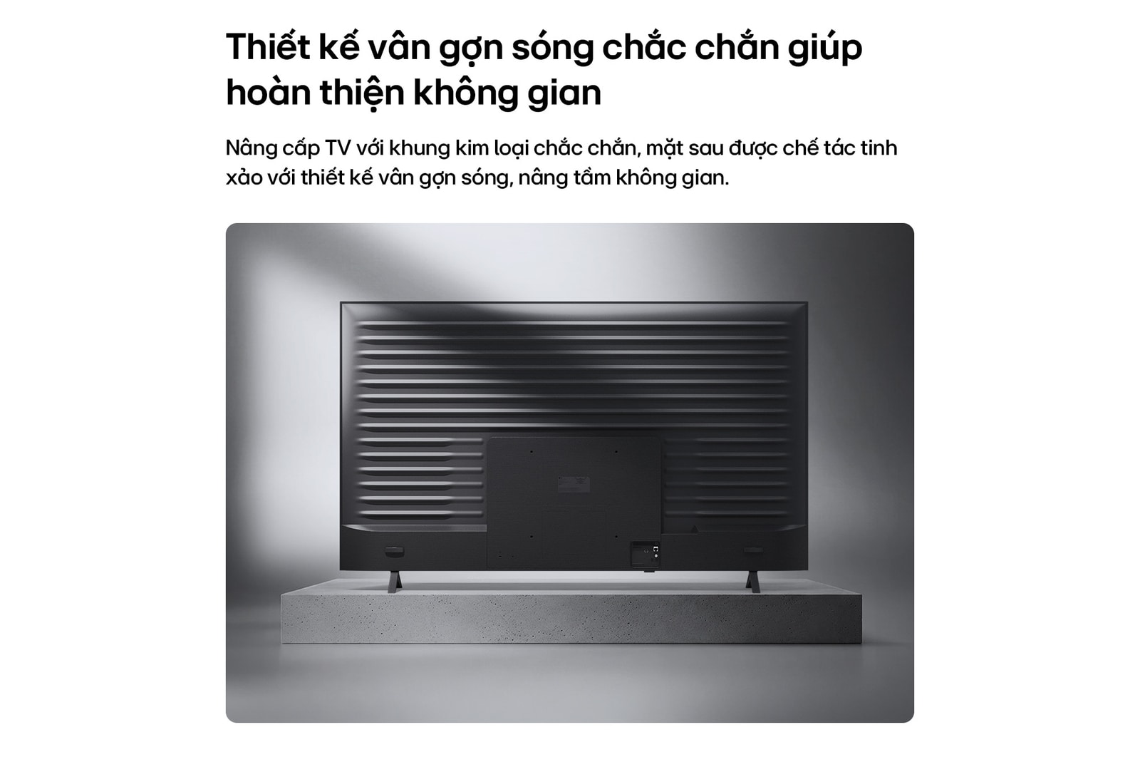 LG NANO 4K UHD AI NU85 is shown from the back, revealing a metallic rear panel with evenly spaced horizontal ridges that create a clean, structured look and emphasize the Linear Flow Design across the entire surface.